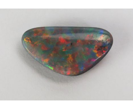 A Black Fire Opal Polished Specimen, 16.7x9.1mm, .78g. We are not certain this is a singlet