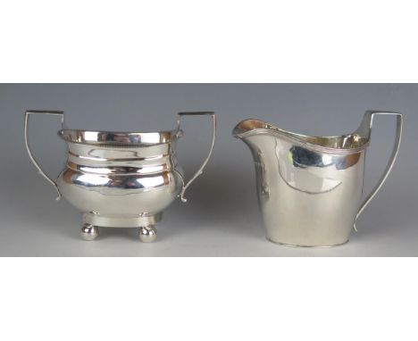 A George V silver twin handles sugar basin, maker Elkington &amp; Co, Birmingham, 1919, raised on ball feet, 13cm wide, toget