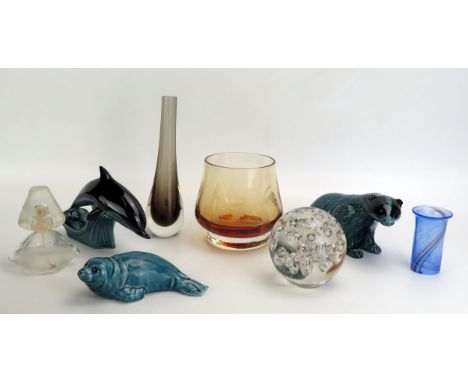 A Poole pottery model of a badger, 18cm long, another of a seal and a dolphin, a glass paperweight , scent bottle, vases etc.