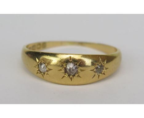 An 18ct Gold and Old Cut Diamond Three Stone Gypsy Ring, size P.5, Birmingham 1900, H&amp;S, 3.39g 