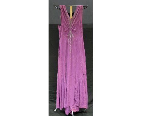 A 1920's/30's ladies cocktail dress in purple with fringed V-neck line with applied paste set decoration. 