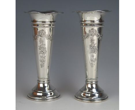 A pair of George V silver vases, maker William Hutton &amp; Sons Ltd, Birmingham, 1913, of trumpet-shaped outline, with garla