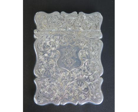 A Victorian silver card case, maker S Blankensee a &amp; sons Ltd, Birmingham, 1899, monogrammed, with chased foliate and scr