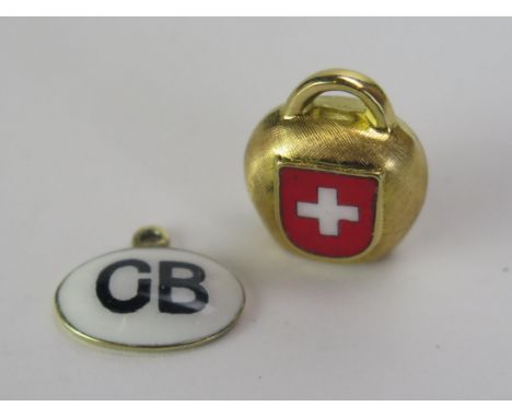 A 9ct Gold and Enamel GB 'Sticker' Car Charm (hallmarked 1.1g) and unmarked precious yellow metal and enamel Swiss Alpine bel