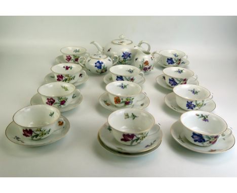 A Rosenthal porcelain part tea service with polychrome iris and convolvulus pattern decoration, includes eleven tea cups, twe