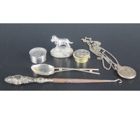 A collection of mixed silver wares including dog model, locket, golfing spoon, 