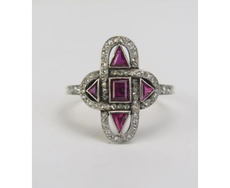 An Antique Ruby and Rose Cut Diamond Panel Ring in a precious yellow and white metal setting, 18.7x13.95mm head with three fu