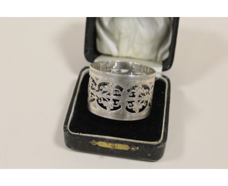 A BOXED PIERCED HALLMARKED SILVER NAPKIN RING