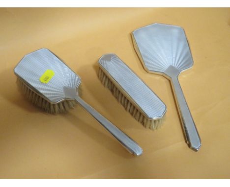 A HALLMARKED SILVER GUILLOCHE ENAMEL THREE PIECE DRESSING TABLE SET