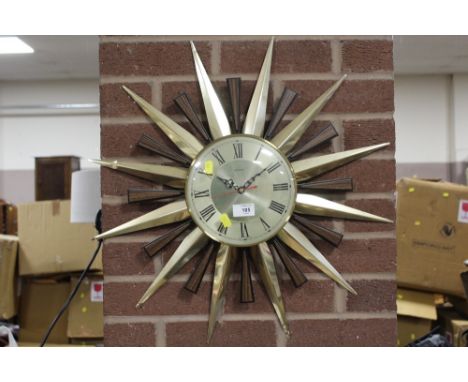 A RETRO SUNBURST METAMEC METAL SPIKED WALL CLOCK 