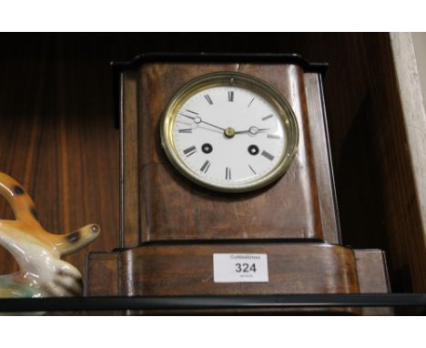 A VINTAGE MAHOGANY FRENCH BELL STRIKING MANTEL CLOCK