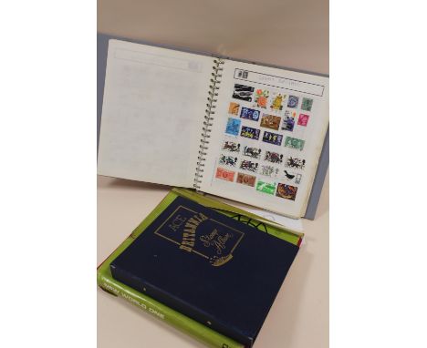 FOUR ALBUMS OF VINTAGE STAMPS 