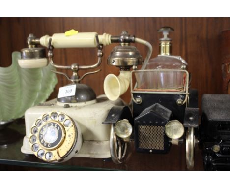 A VINTAGE TELEPHONE TOGETHER WITH A NOVELTY VINTAGE CAR SHAPED DRINKING GLASS SET AND ANOTHER (3)