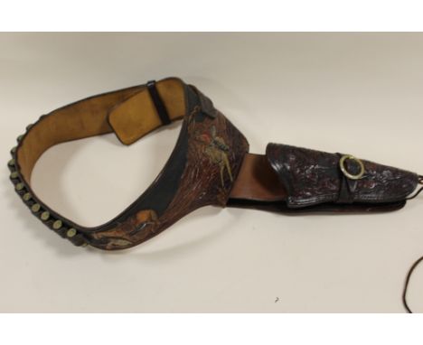 A VINTAGE EMBOSSED LEATHER GUN BELT 