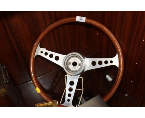 A VINTAGE WOODEN CAR STEERING WHEEL, STAMPED 'LL'