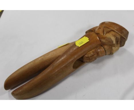 A PRISONER OF WAR STYLE CARVED WOODEN NUT CRACKER A/F
