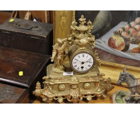 A FRENCH GILT METAL FIGURAL MANTEL CLOCK