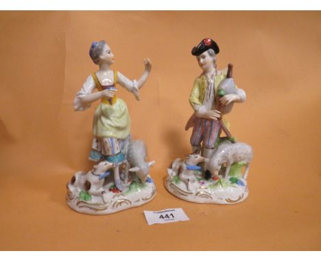 A PAIR OF VINTAGE CERAMIC FIGURES WITH CROSSED SWORD BACK STAMPS