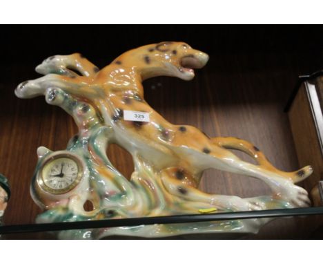 A MERCADES LUSTRE MANTEL CLOCK IN THE FORM OF A LEOPARD