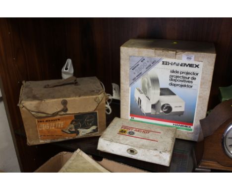 A BOXED HANIMEX SLIDE PROJECTOR, A BOXED DUSTETTE HOOVER, VINTAGE FIRST AID KIT ETC.