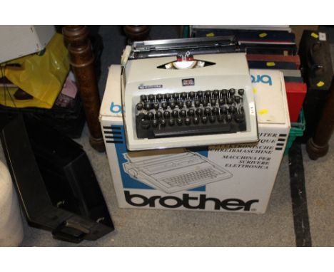 A BOXED BROTHER TYPEWRITER TOGETHER WITH A CONTESSA EXAMPLE