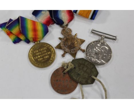 A GROUP OF THREE WWI MEDALS AWARDED TO 13172 PTE. S. SMITH. N. STAFFS. R. AND DOG TAGS 