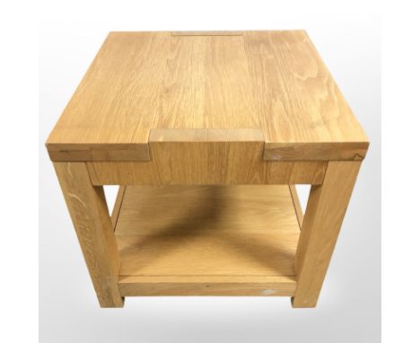 A contemporary oak veneered lamp table, width 55 cm.