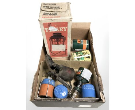 A Tilley storm light, vintage blow lamp, camping stoves with fuel (1 box)