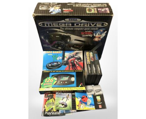 A Sega Megadrive 16-bit games console with original box, several games, a TV Boy video games console, etc. 