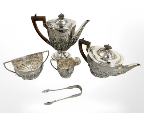 A silver four piece non matching tea service, together with pair of silver sugar tongs, London, 1898-1904. CONDITION REPORT: 