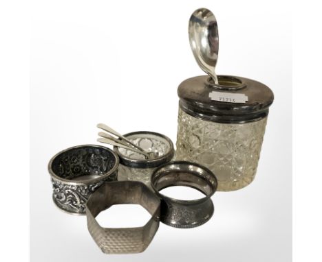 A silver teaspoon, three caddy spoons, three napkin rings, silver mounted cut glass salt and similar preserve pot  CONDITION 
