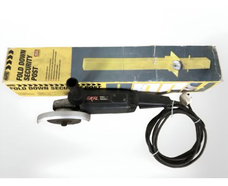 An angle grinder and a fold down security post in box.