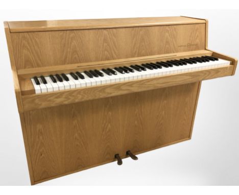 An Andreas Christensen light oak mini piano, width 120 cm 