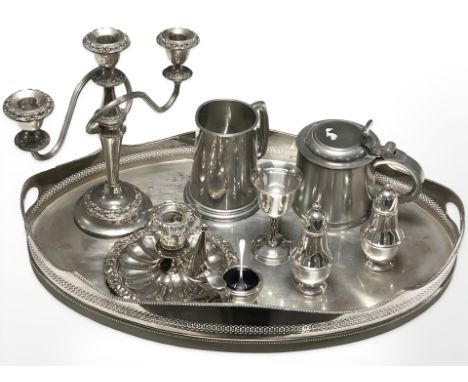 A silver plated twin handled oval gallery tray, candelabrum, pewter tankard, pair of sifters, chamber stick, etc.