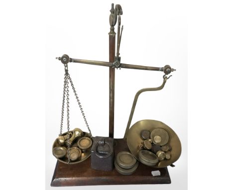 A set of brass scales, various weights 
