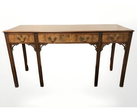 A Chippendale style mahogany side table, fitted with three drawers, width 159 cm 