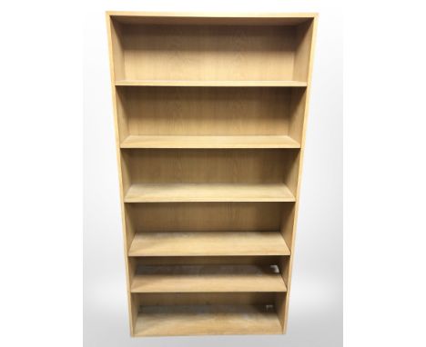 A light oak adjustable bookcase, width 101 cm height 191 cm 