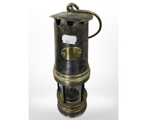 A 19th century steel and brass miner's lamp, numbered 132 