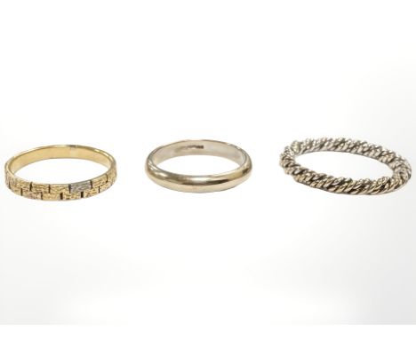 A texture gold band ring, a 9ct gold ring and a further rope twist example.  CONDITION REPORT: Textured ring unmarked - 2.3g.