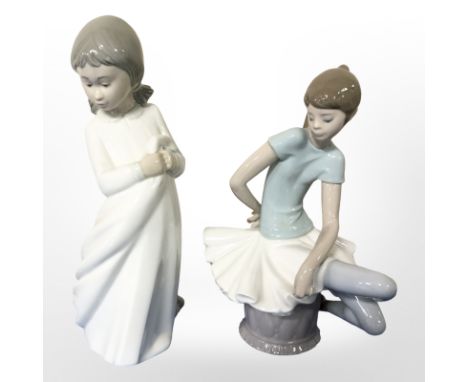 A Lladro seated ballerina and a Nao figure of a girl, tallest 25 cm 