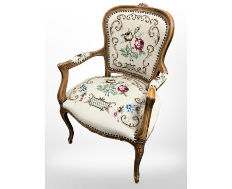A continental walnut tapestry armchair, width 62 cm.