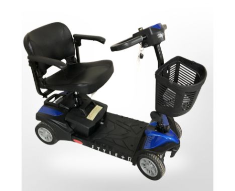 An electric mobility scooter with power charger.