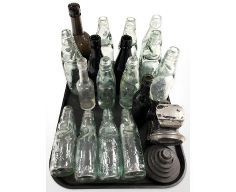 A group of antique glass bottles bearing advertising including various makers from Newcastle, Bishop Auckland, Consett, Gates