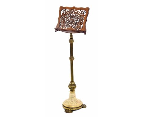 Victorian adjustable music stand, the rosewood ledge pierced with scrolling foliage and supported upon a telescopic gadrooned