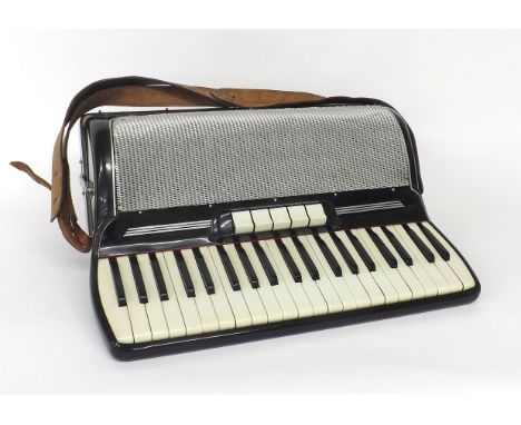 Gaudini piano accordion with one hundred and twenty buttons and five switches, black finish, case 