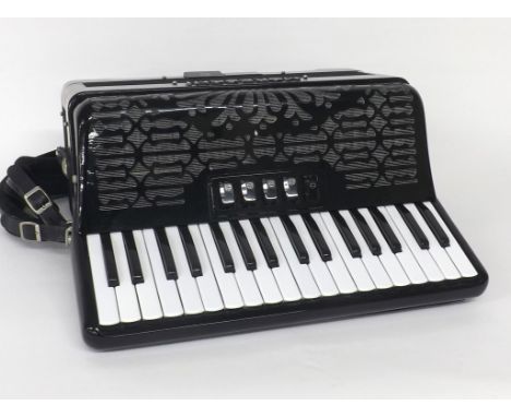Moreschi piano accordion with seventy-two buttons and five switches, black finish, soft case 