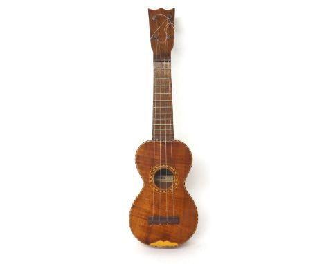 Old Hawaiian ukulele labelled Bergstrom Music Co. Ltd, Hawaiian songs and instruments, Honolulu..., with satinwood back and s
