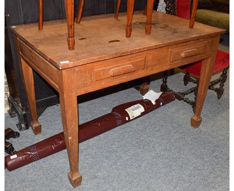 An early 20th century light oak two drawer desk, on square supports with capped feet, 119cm by 74cm by 80cm 
