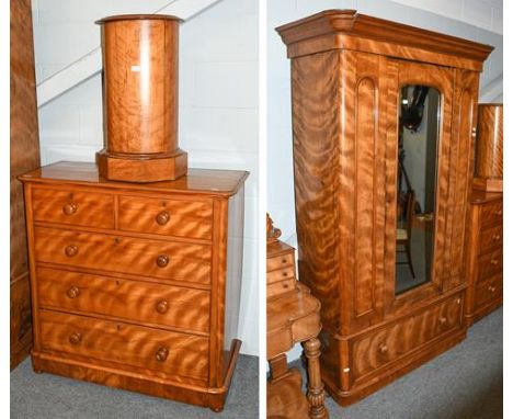 A Victorian satinwood mirror front single wardrobe, 120cm by 50cm by 219cm together with a matching four-height chest of draw