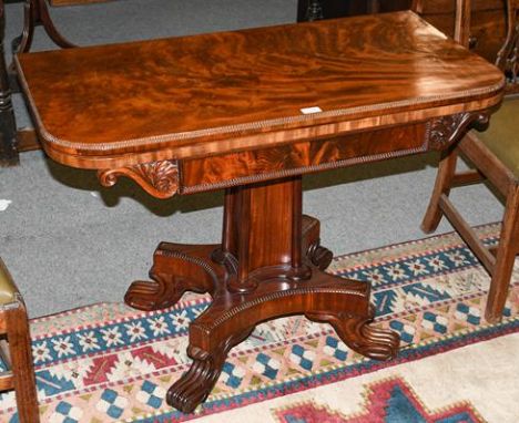 A George IV mahogany foldover card table, 2nd quarter 19th century, the gadrooned border and hinged leaf enclosing a green ba